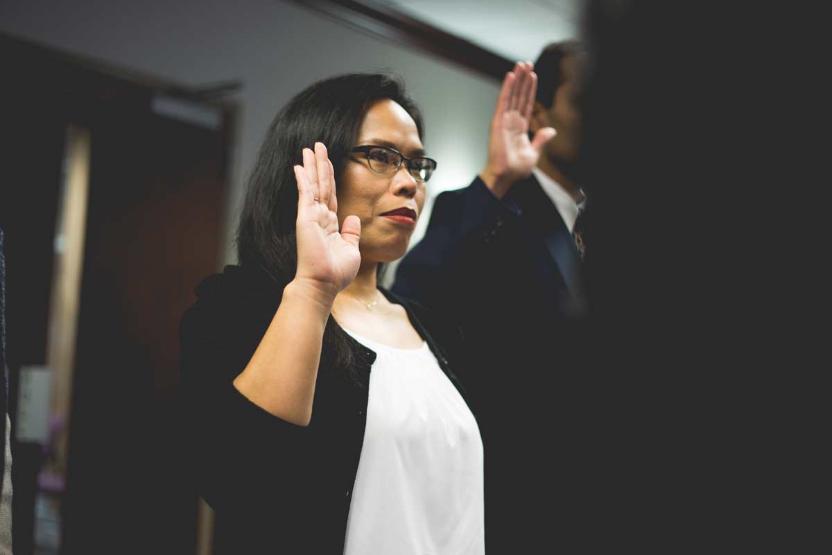 woman taking citizenship oath